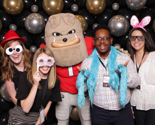 Staff members posing with Hairy Dawg